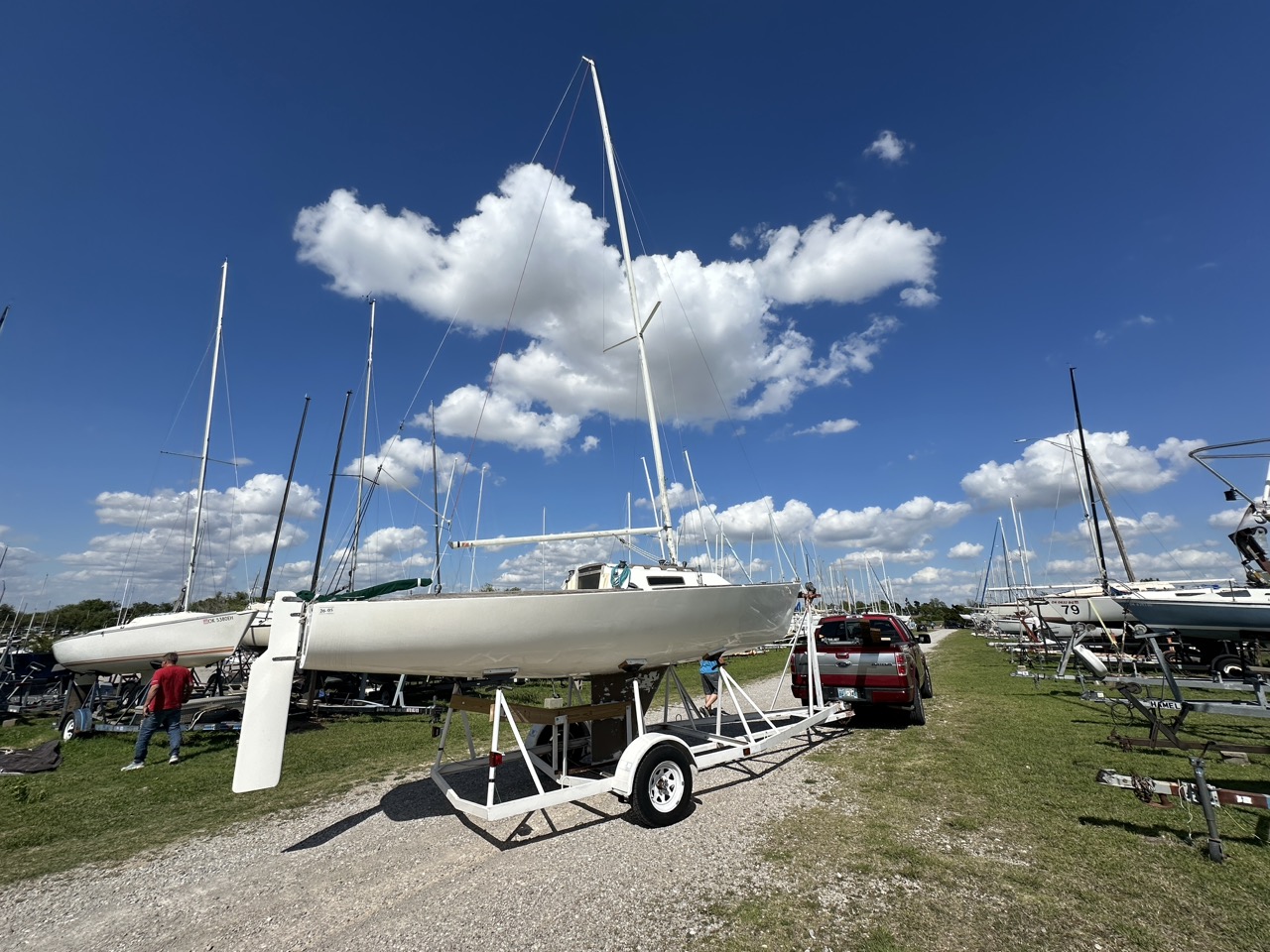 1989 J/22 on its trailer with blue sky overhead