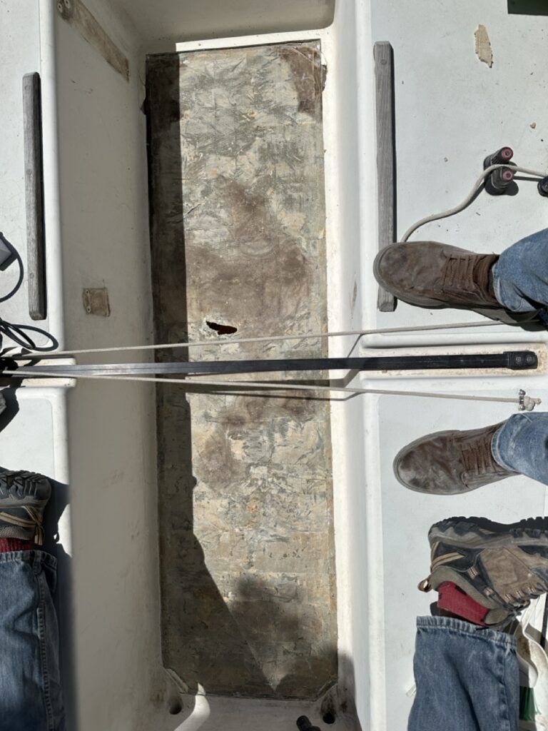 Cockpit sole down to the bare bottom skin, ready for new core